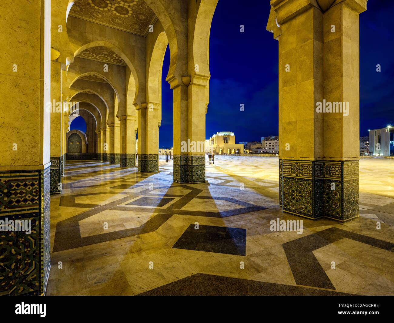 CASABLANCA, MOROCCO - CIRCA APRIL 2018: Exterior corridor and arches of the mosque  Hassan II in Casablanca at night. Stock Photo