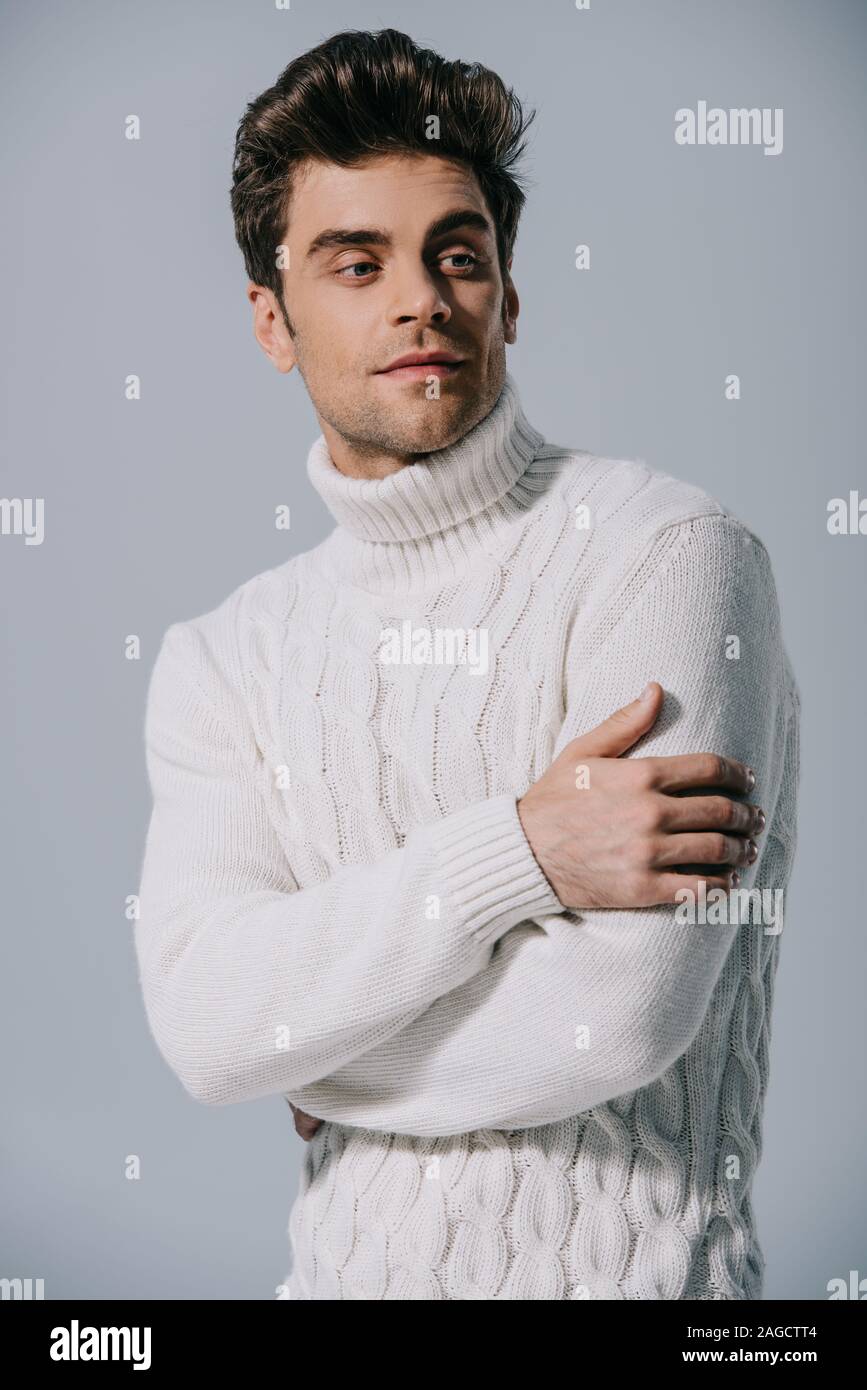 Handsome Man Posing In Knitted Sweater Isolated On Grey Stock