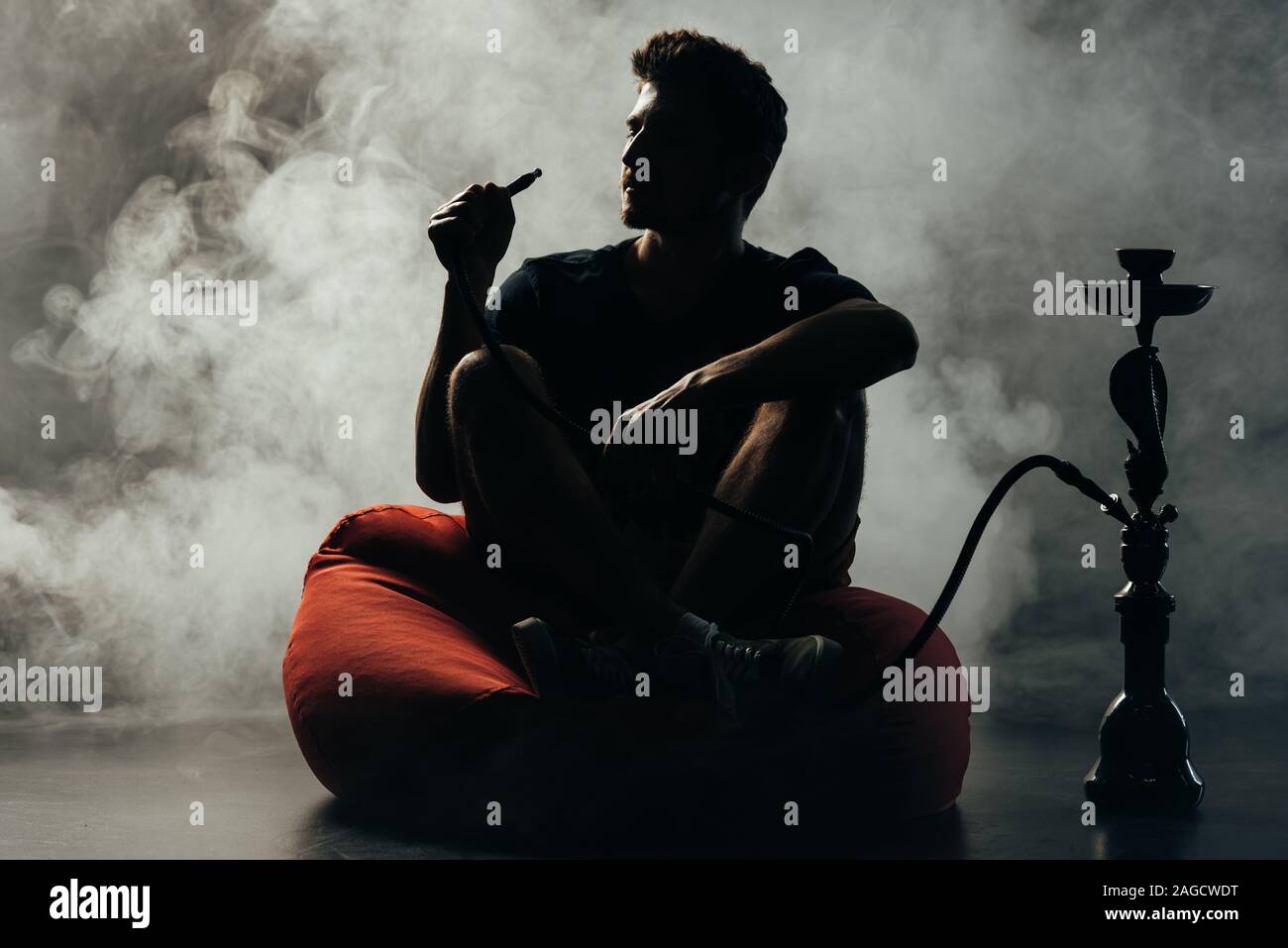 Silhouette man sitting on chair hi-res stock photography and images - Alamy