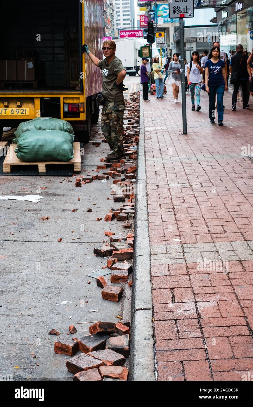 HongKong - November, 2019: Brick stones on street, cleared road ...
