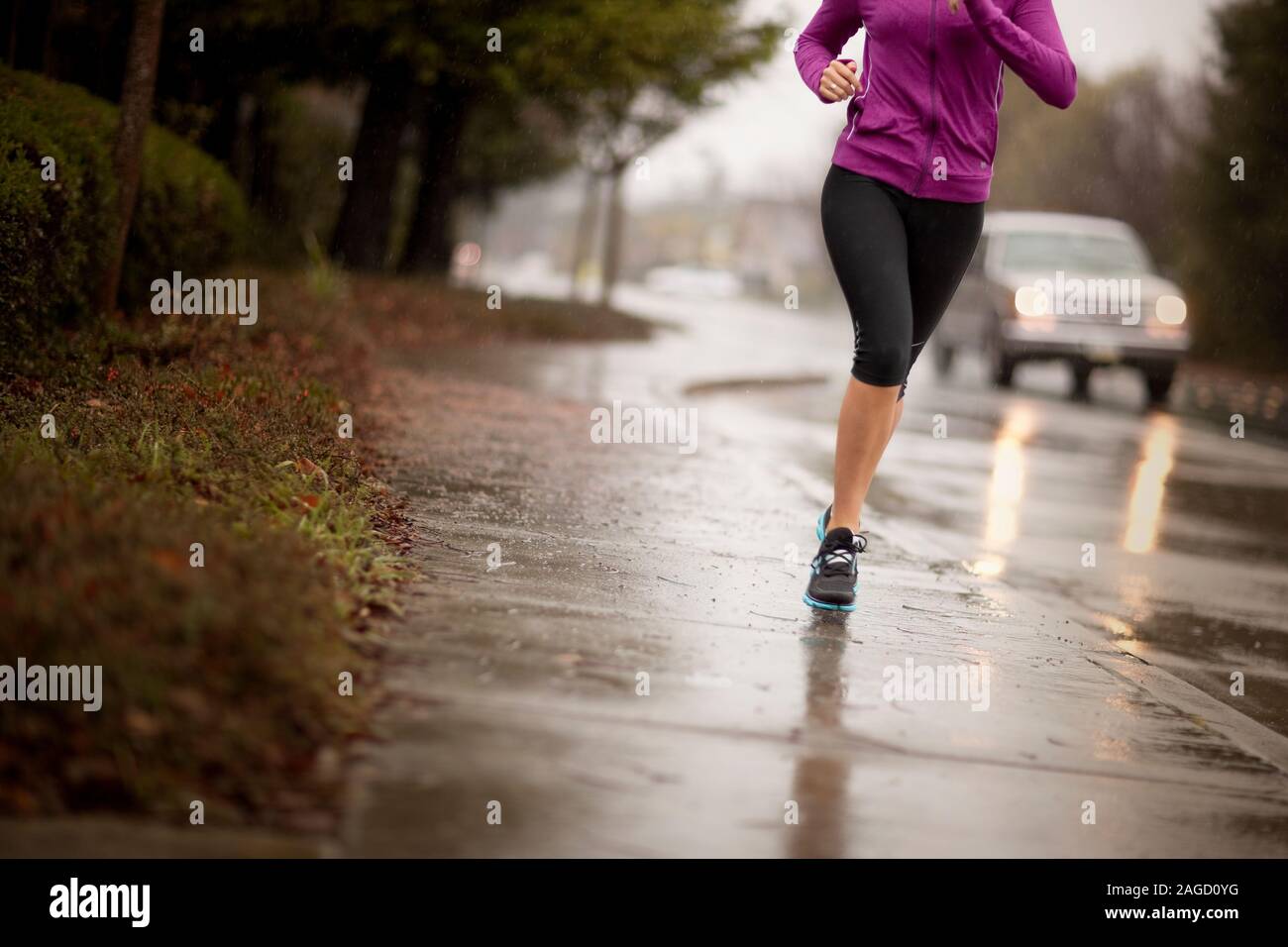 Woman Getting Rained On While Running Women jogging rain hi-res stock photography and images - Alamy