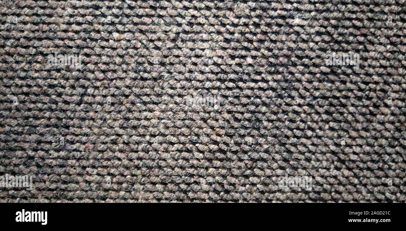 Knitted fabric. Large nodes. Abstract textured background. Stock Photo