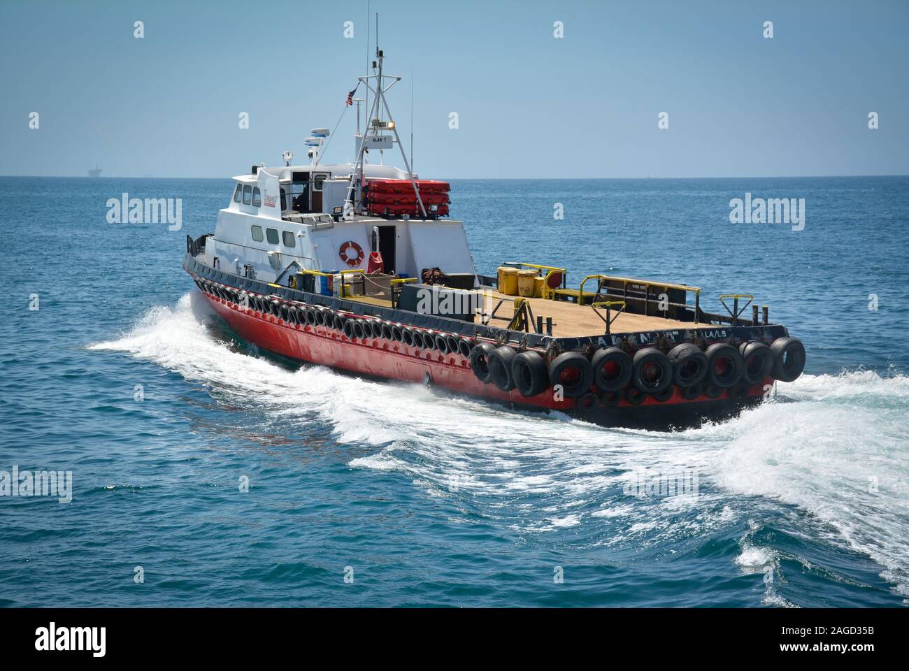 A 100 ft triple diesel screw aluminum crew boat, the 'Alan T', a So Cal Ship Services boat, leaving the Santa Barbara harbor towards the Pacific Ocean Stock Photo