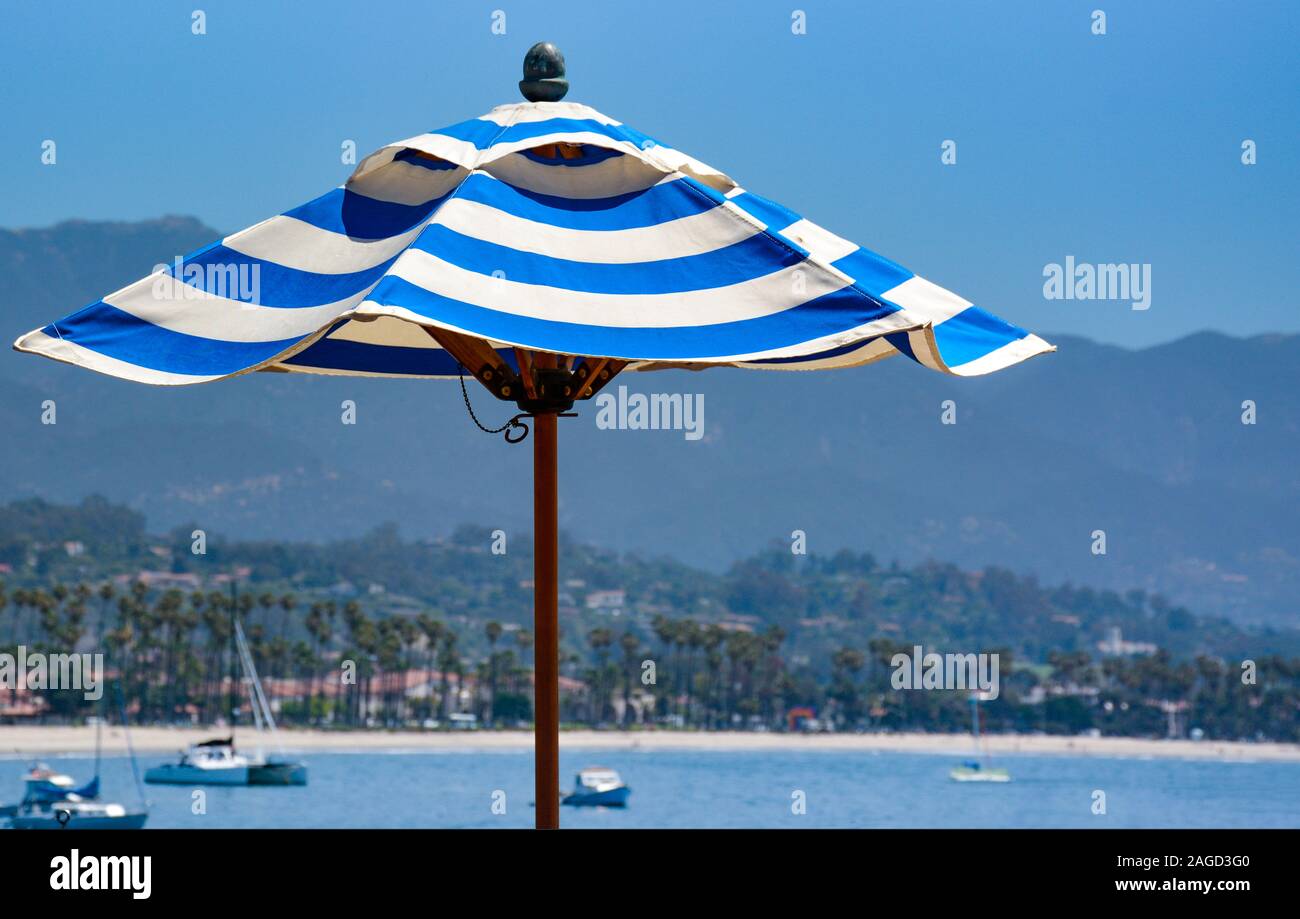 A Close Up Of A Blue And White Striped Beach Or Patio Umbrella With Distant Sailboats In The Santa Barbara Harbor Santa Barbara Ca Usa Stock Photo Alamy