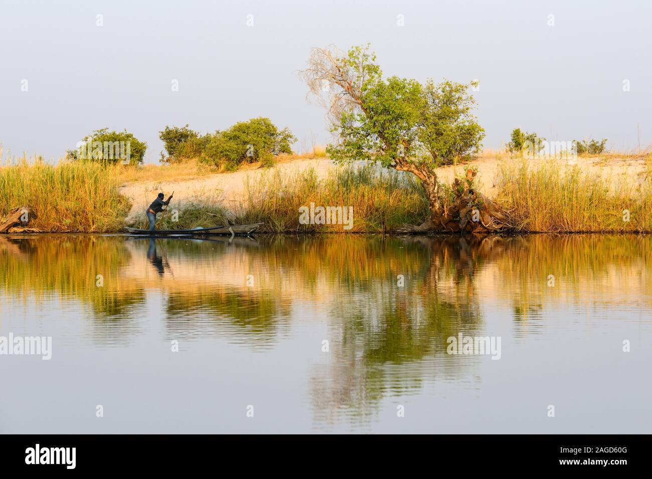 Early morning view of fisherman next to riverbank on Chobe River in Chobe National Park, Botswana, Southern Africa Stock Photo