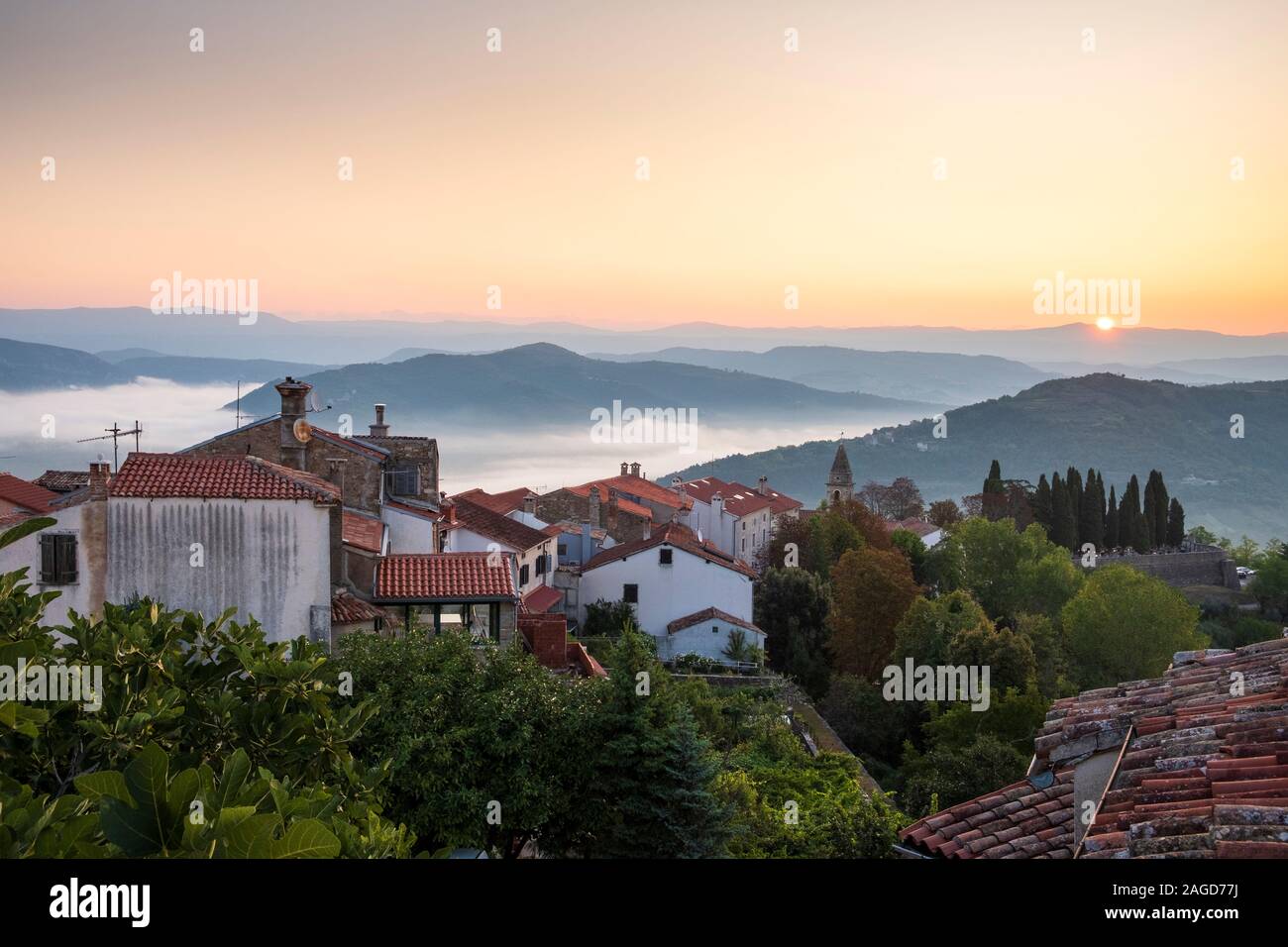 View over Village at sunrise  with surrounding mountains, Motovun, Istria, Croatia Stock Photo