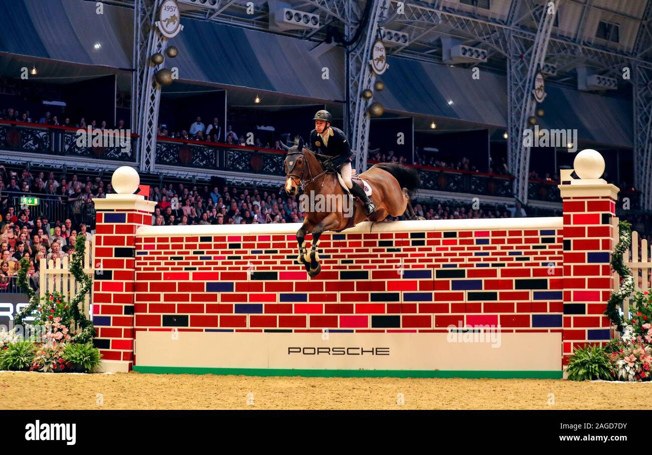 William Whitaker riding RMF Charly competes in the Cayenne Puissance during day three of The London International Horse Show at London Olympia. Stock Photo
