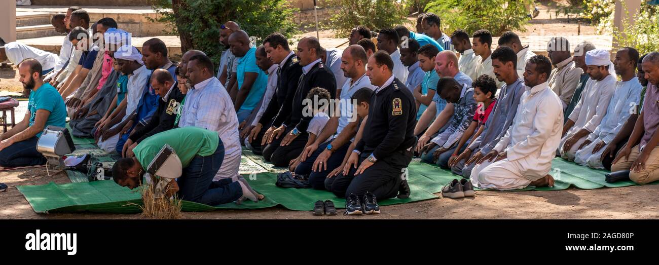 November 2019, EGYPT - Moslem Men pray during 'Call to Prayer' Philae Temple Stock Photo