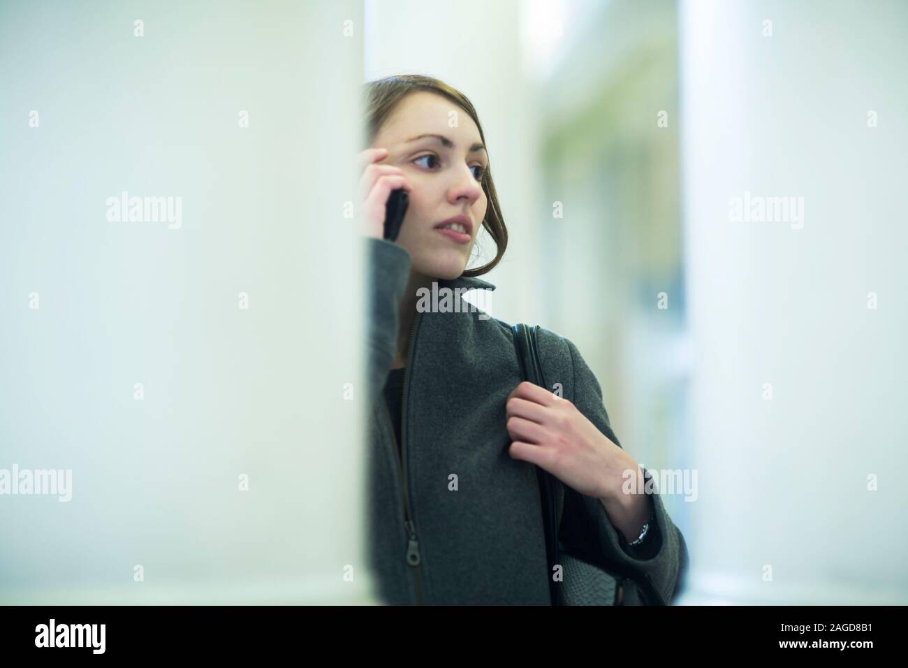 Young woman using smartphone Stock Photo