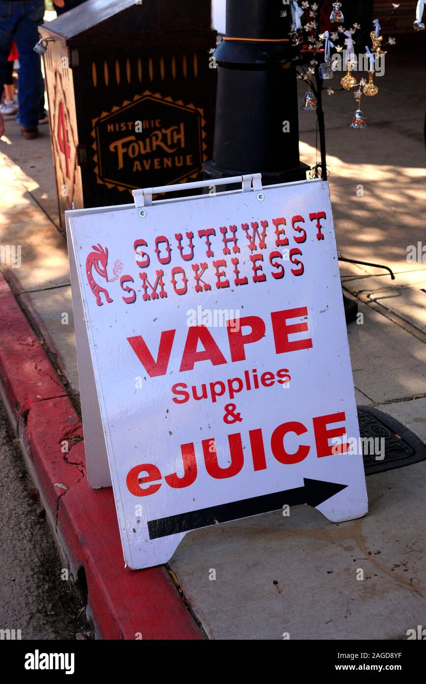 Vape supplies and ejuice sign-board on the sidewalk of Fourth Ave in Tucson, AZ Stock Photo