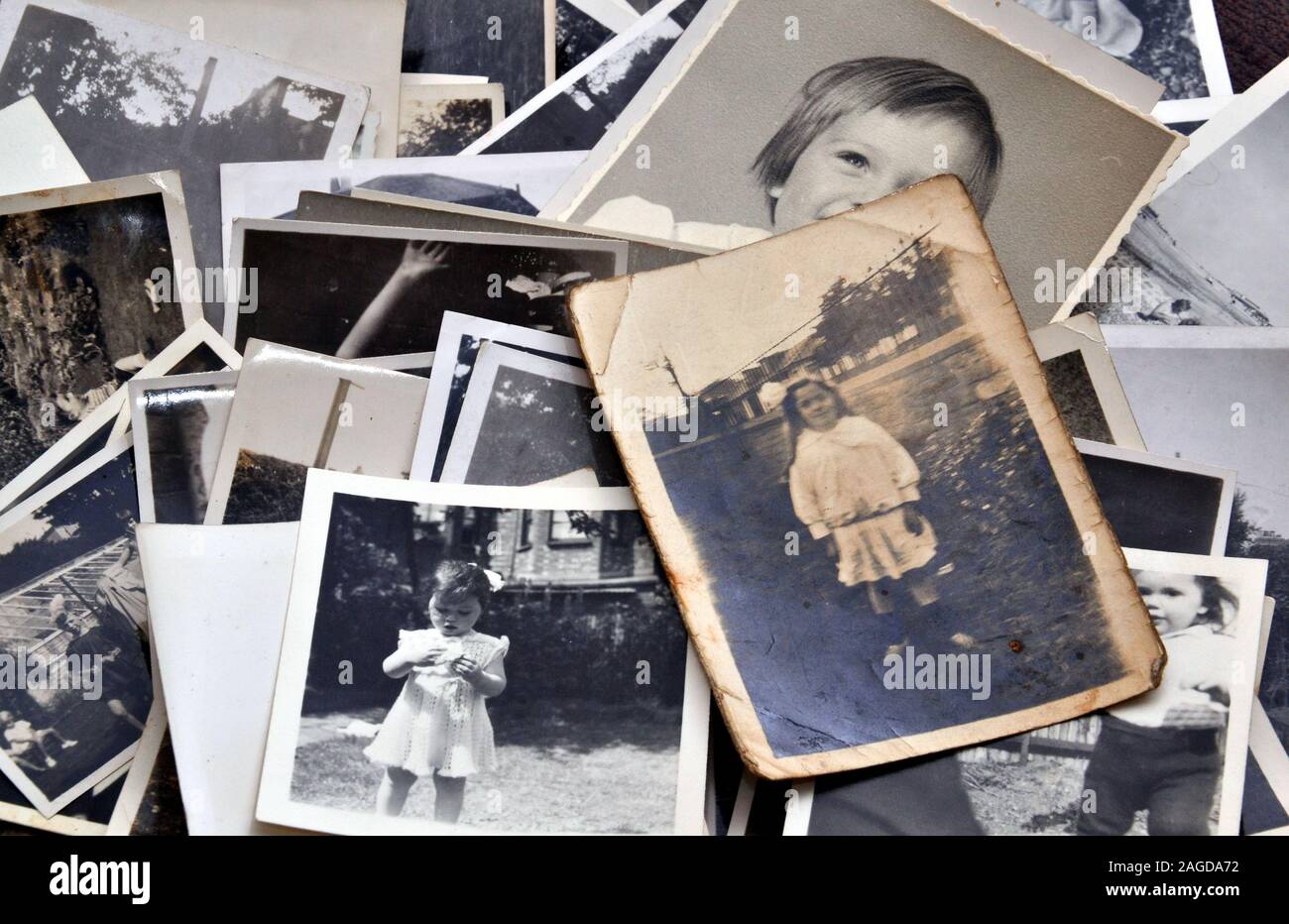 A collection of old, vintage black and white family photographic prints Stock Photo