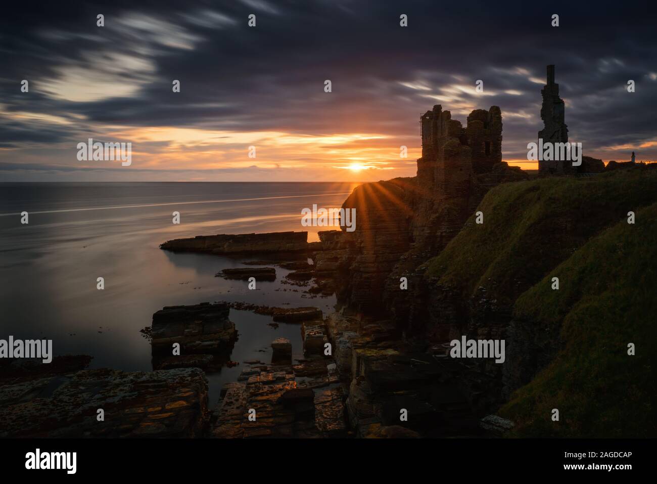 Castle Sinclair Girnigoe cliffs on east coast of Scotland in sunrise Stock Photo