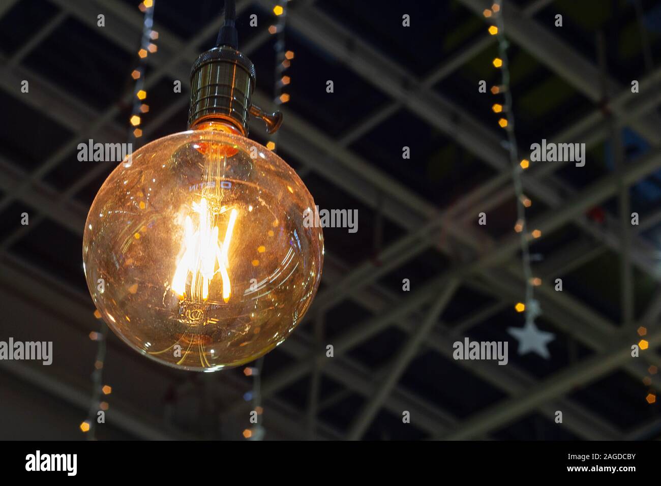 light bulb with thread filament festive illuminations vintage Stock