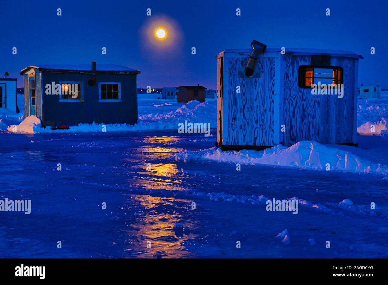 Ice Fishing Village under a full moon Stock Photo Alamy