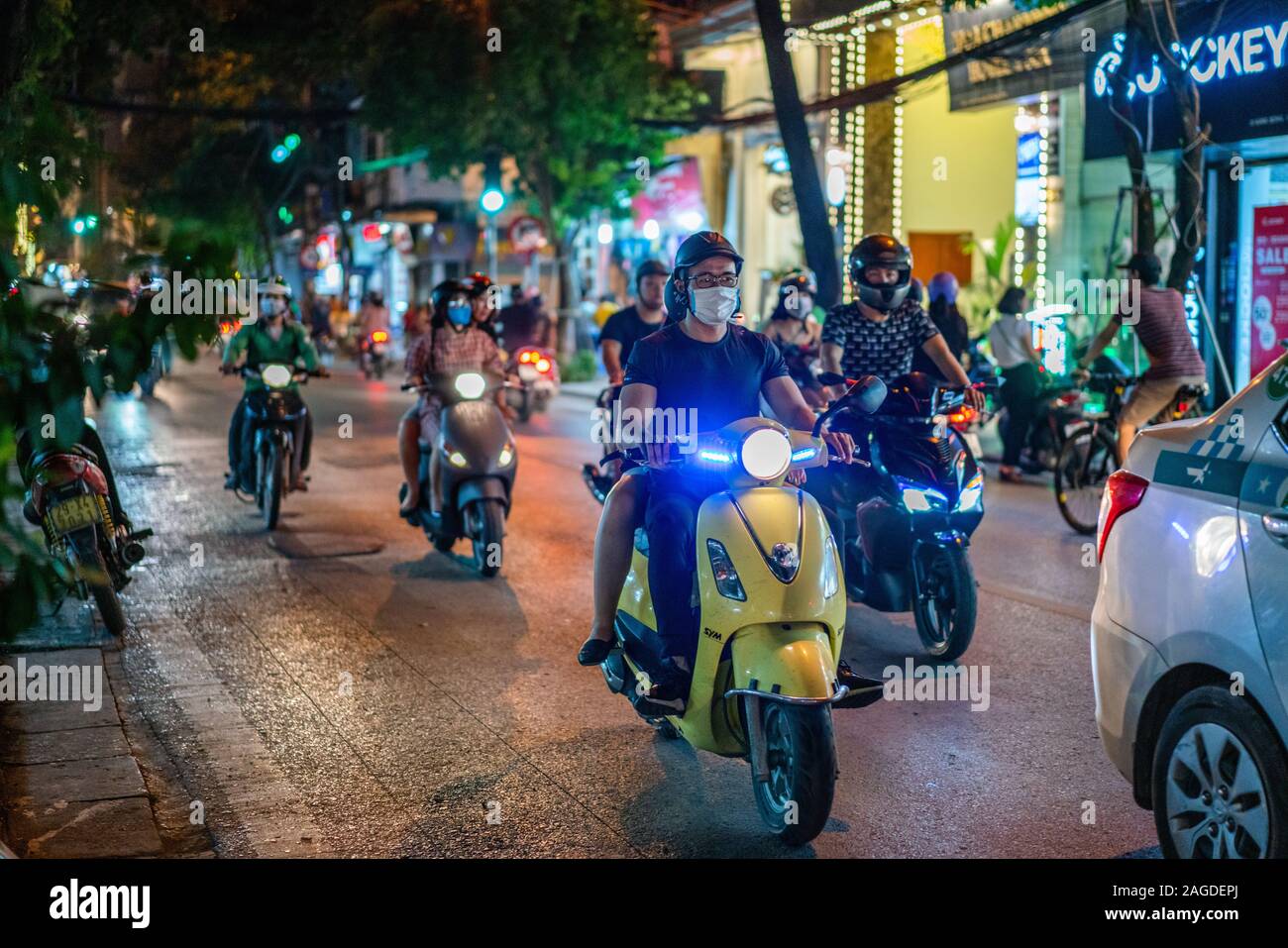 HANOI, VIETNAM - Oct 22, 2019: A group of people wearing masks riding cool motorcycles in Hanoi, Vietnam Stock Photo