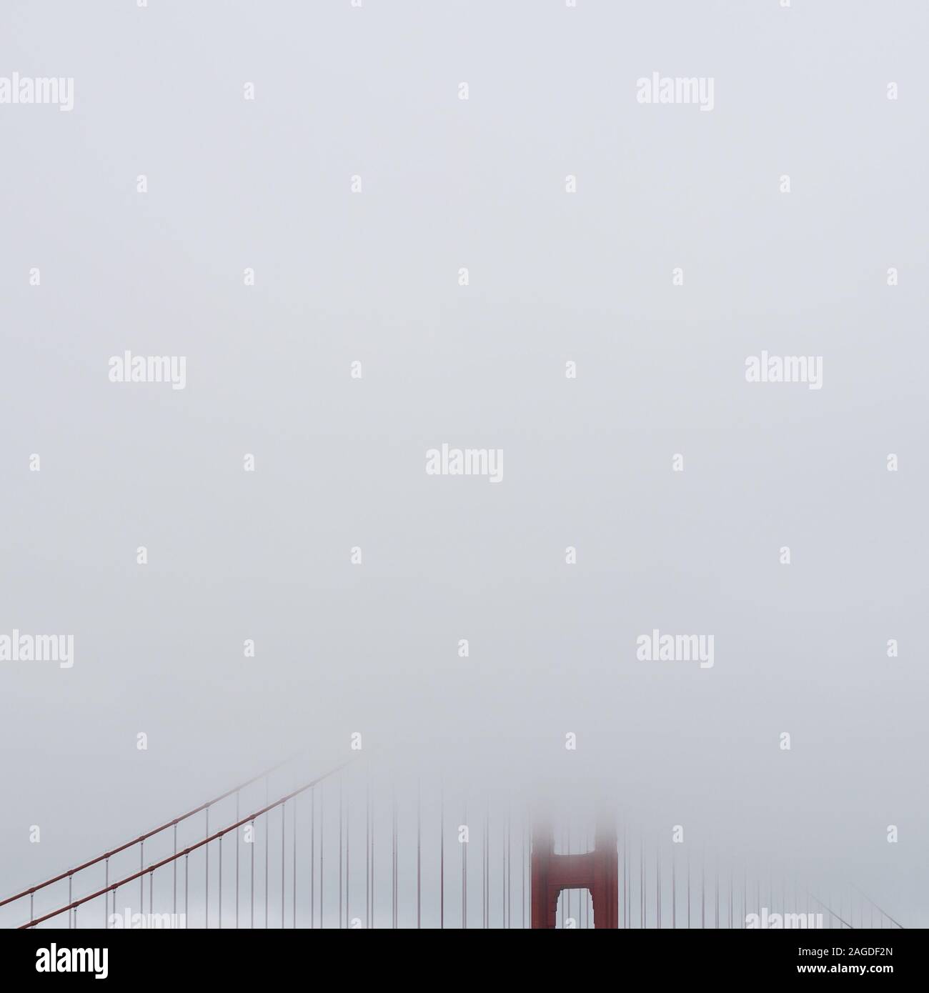 Golden Gate Bridge covered with fog in the early morning Stock Photo