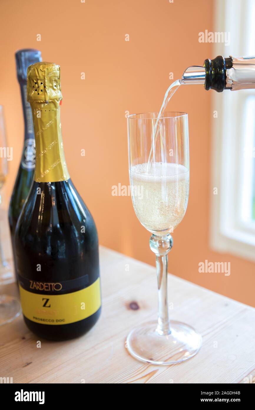 close up of champagne being poured into glass Stock Photo