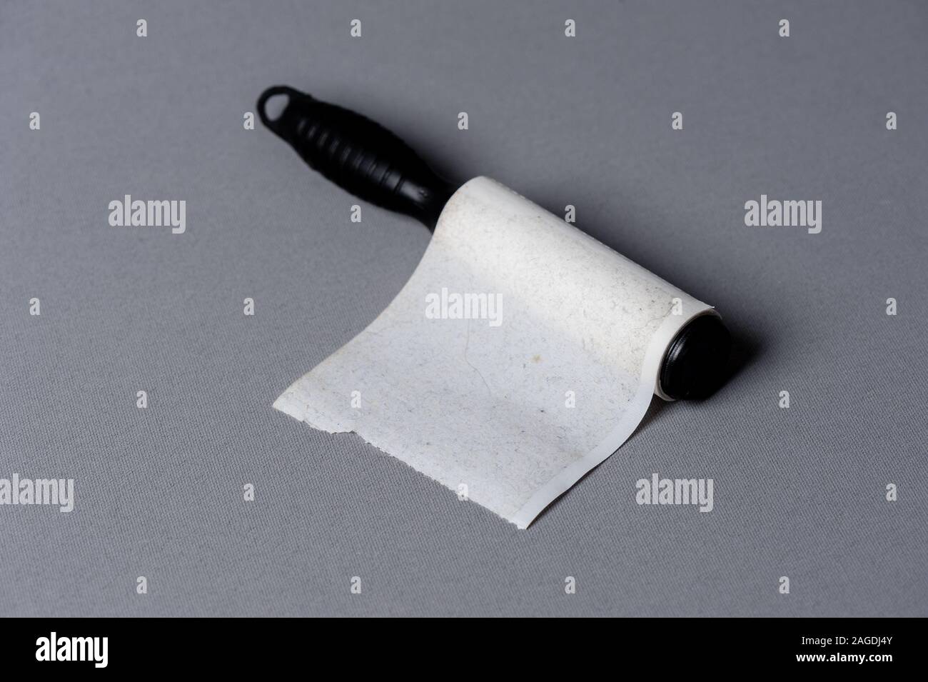 adhesive lint roller, the device used to remove small dust or fibers on