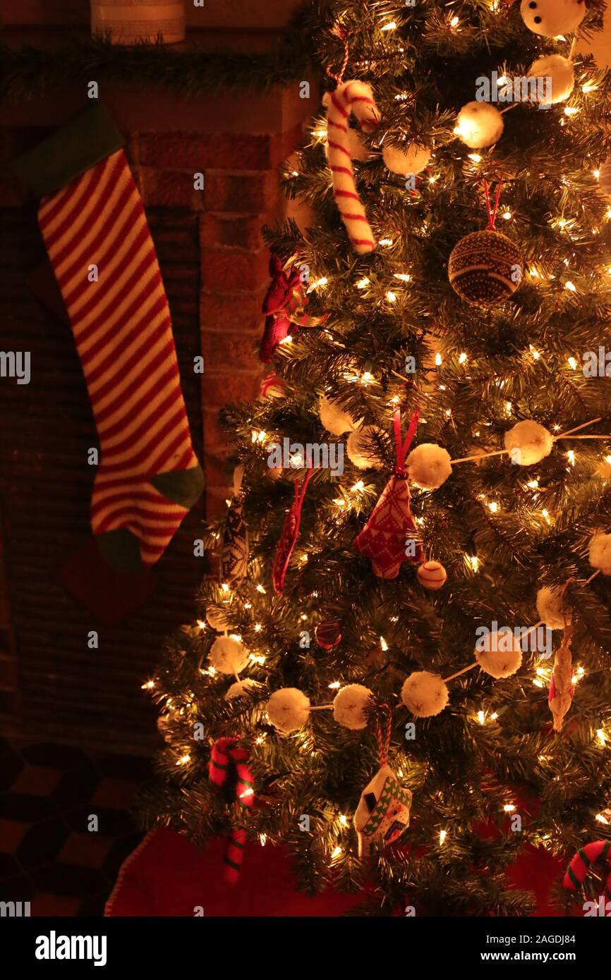 A beautifully decorated Christmas tree indoors with shining lights and