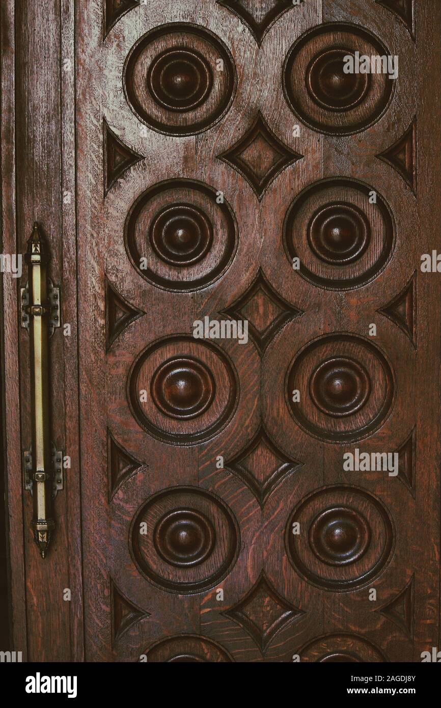 Vertical shot of a wooden door with circle designs - a cool picture for  backgrounds and wallpapers Stock Photo - Alamy