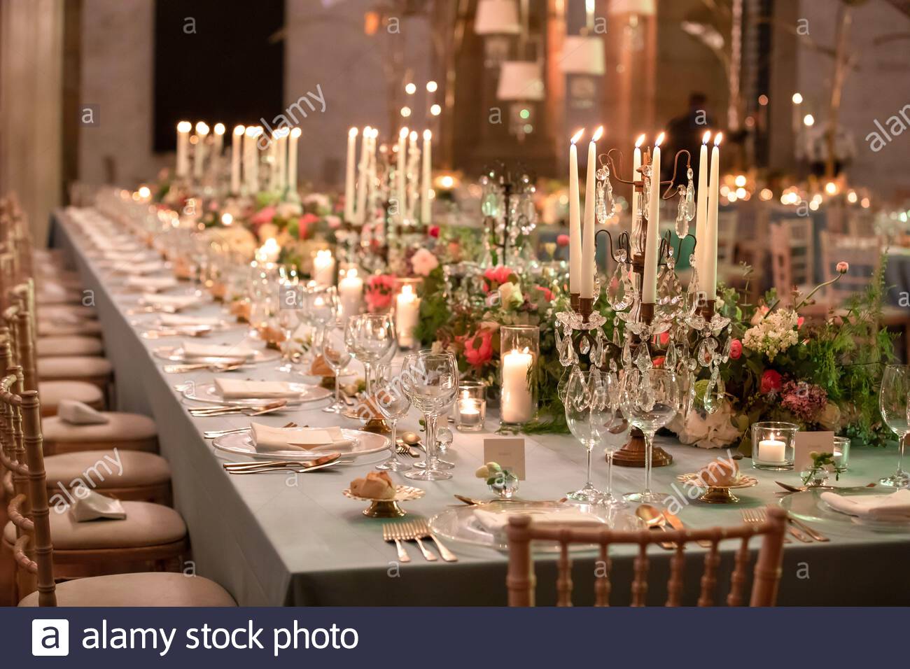 A beautiful wedding table setting with floral decorations A beautiful wedding table setting with floral decorations