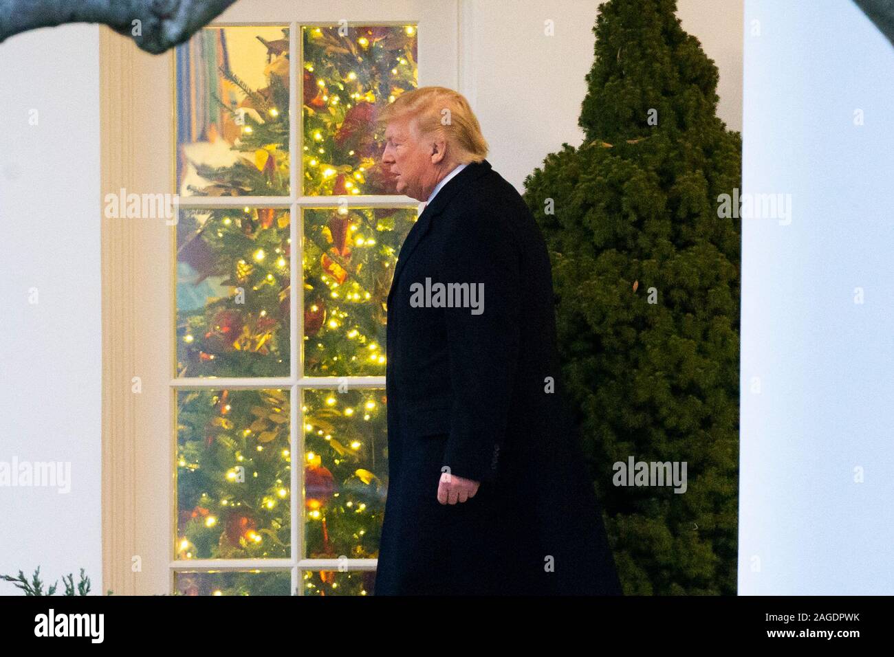 US President Donald J. Trump walks out of the Oval Office to depart the ...