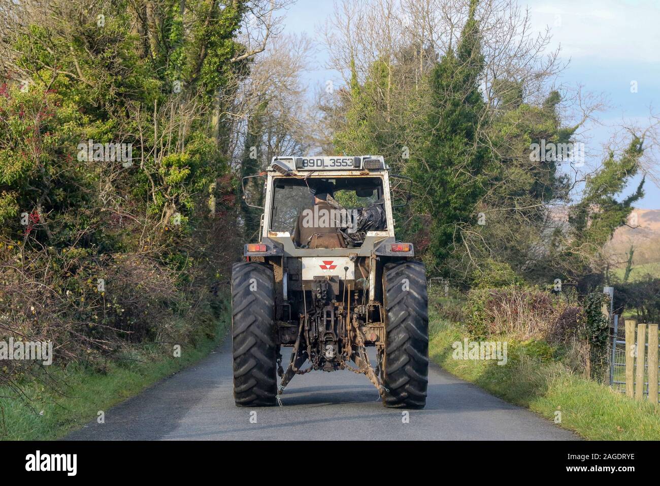 Farming in Ireland with an Irish farmer driving an old Mitsubishi