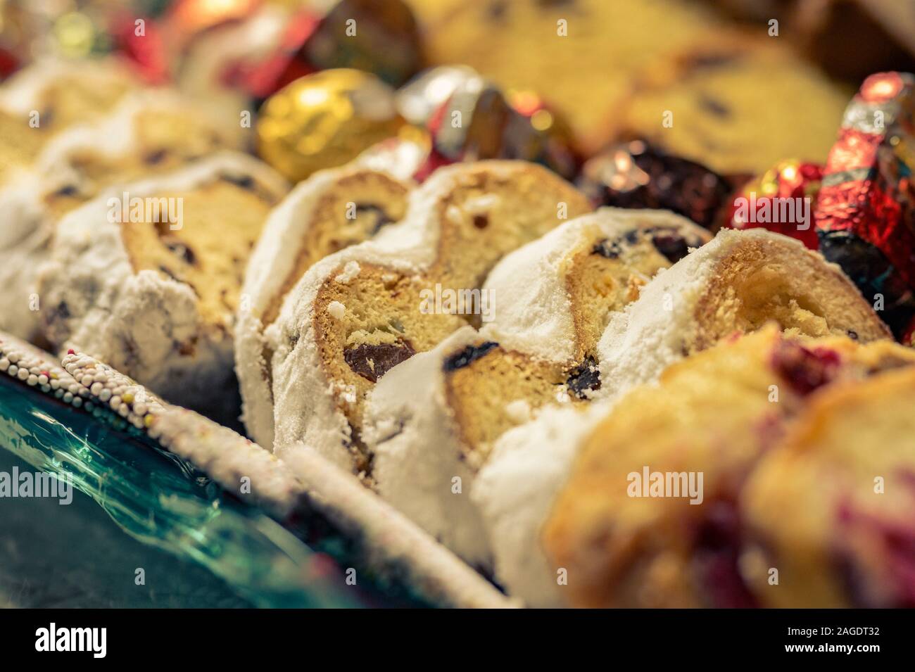 German Christmas stollen with cookies and treats for a holiday tray. Stock Photo