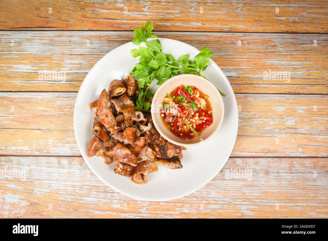 Roasted pork Chitterlings with chilli sauce spicy / entrails intestines