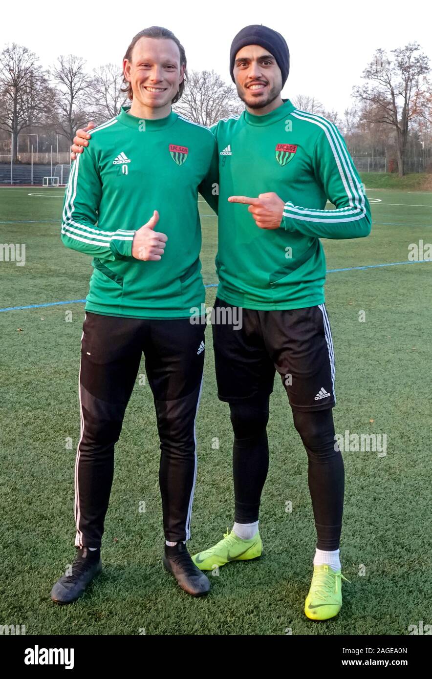 Schweinfurt, Germany. 05th Dec, 2019. Christian Köppel (l) and Mohamad  Awata (r), soccer player at the 1st FC Schweinfurt 1905, are standing on  the training ground. Awata was a professional soccer player