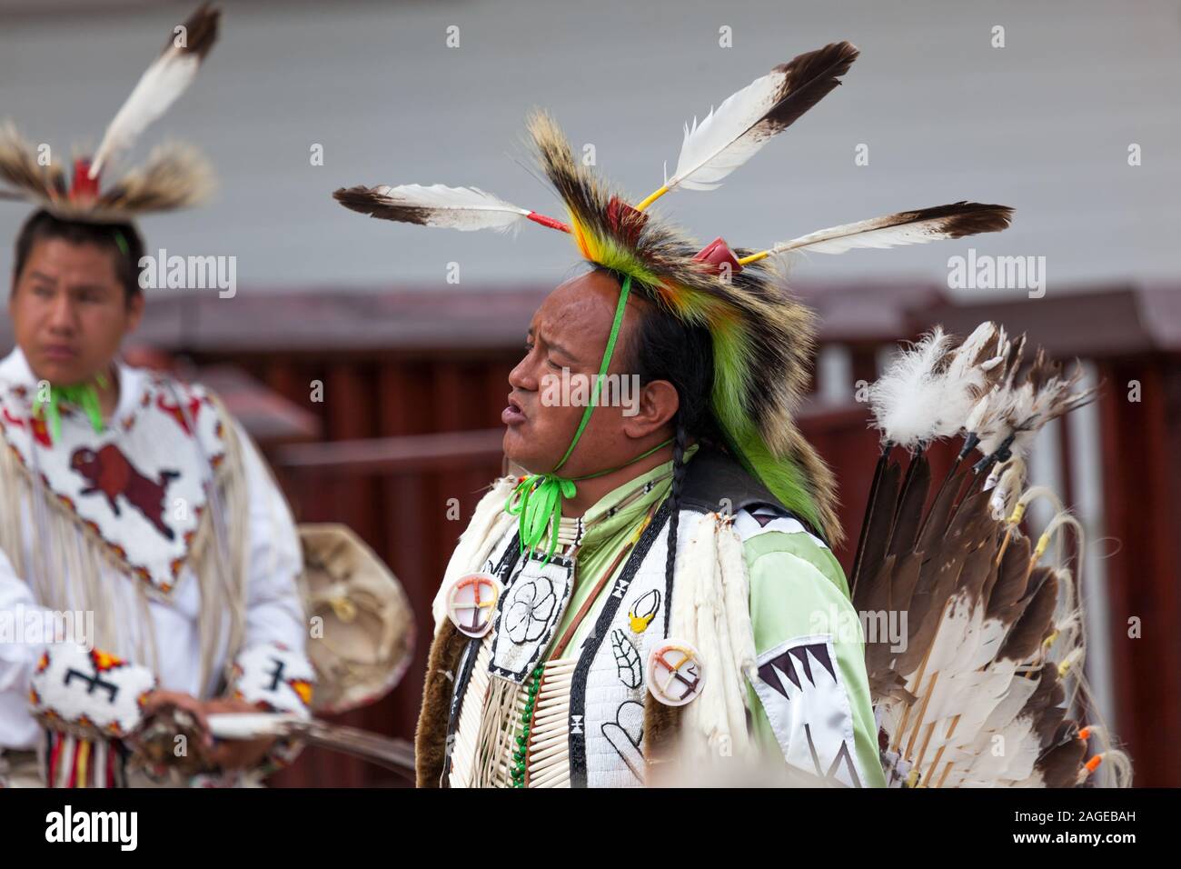 CUSTER, SOUTH DAKOTA June15, 2014 A Native American man in tribe specific clothing giving a