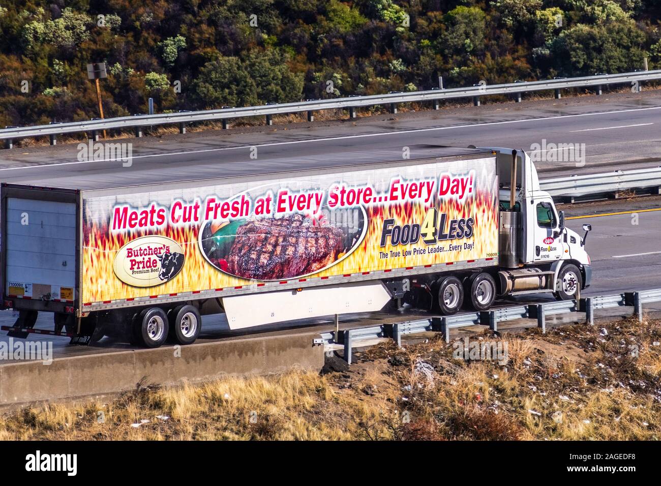 Dec 8, 2019 Los Angeles / CA / USA - Food 4 Less truck driving on the freeway; Food 4 Less is a national grocery store grocery chain, currently owned Stock Photo