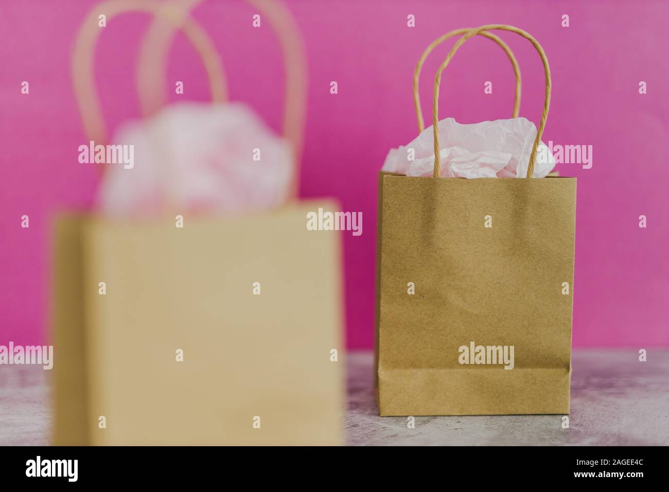 original product vs dupe imitation conceptual still-life, shopping bags  with labels side by side with similar paper color symbol of cheap product  alte Stock Photo - Alamy