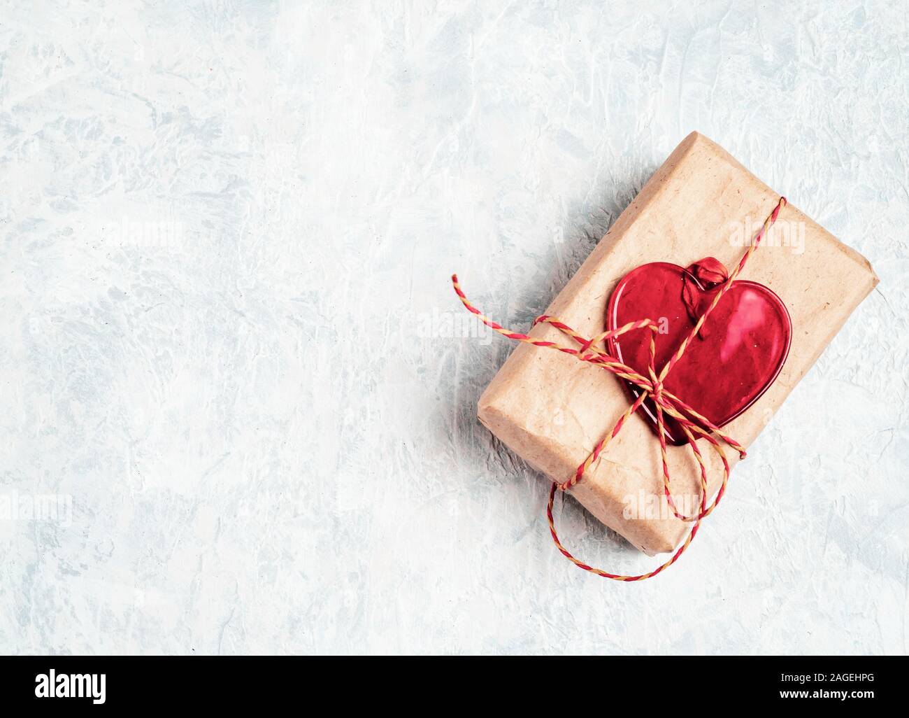 Valentine's Day Gift box with a red bow and heart Stock Photo - Alamy