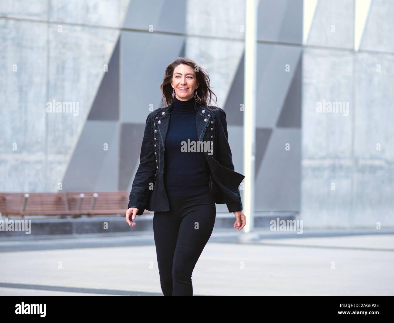 Black woman walking in suit hi-res stock photography and images - Alamy