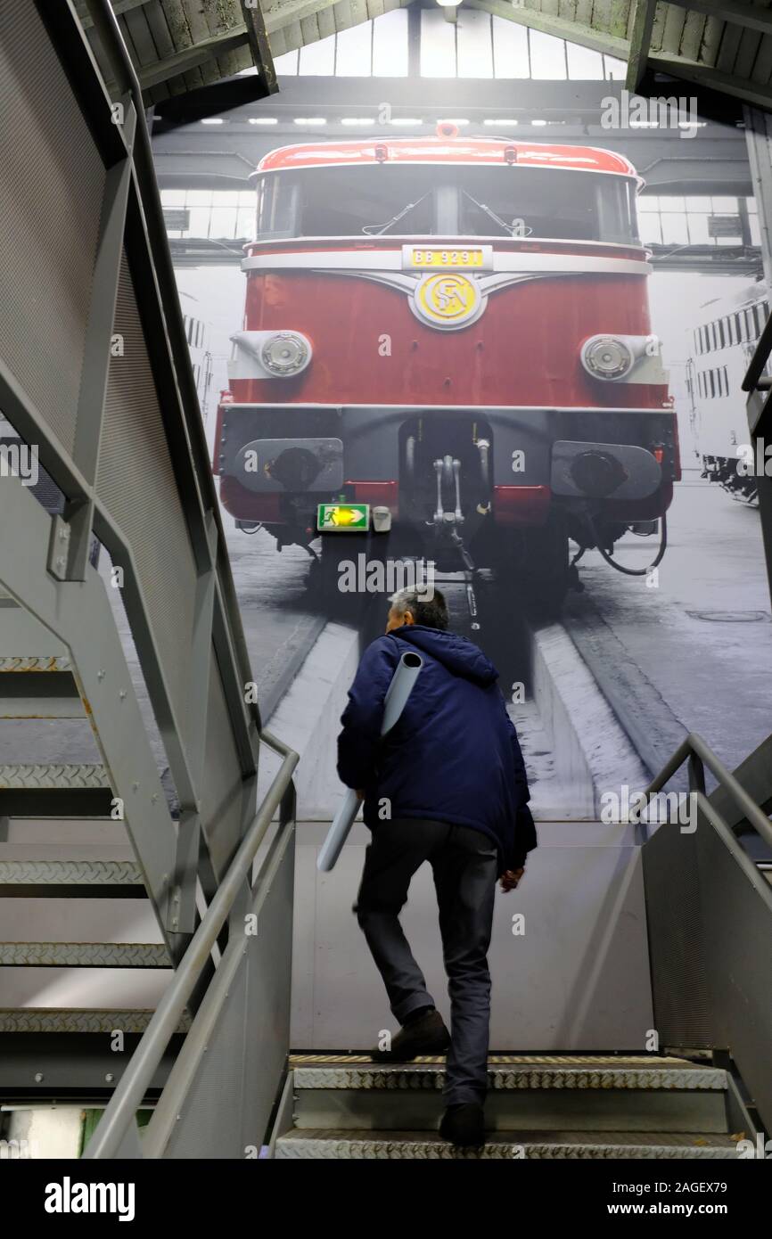 A locomotive photo image decorated the staircase wall in Ground Control a former warehouse of SNCF, nowadays an art culture and street style food hall and space in 12th Arrondissement.Paris.France Stock Photo