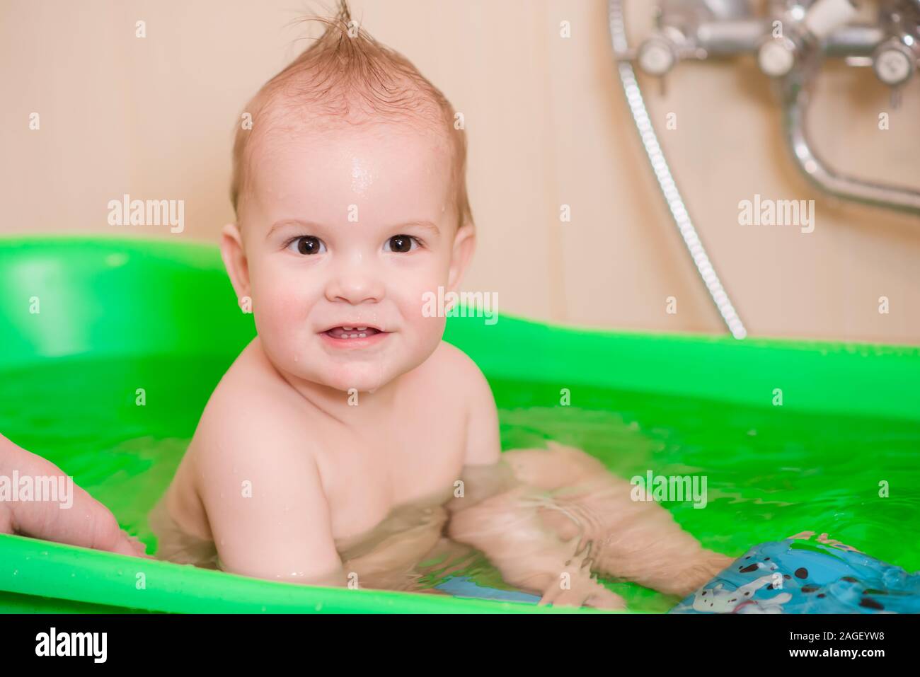 little kid with his mom to clean Stock Photo Alamy