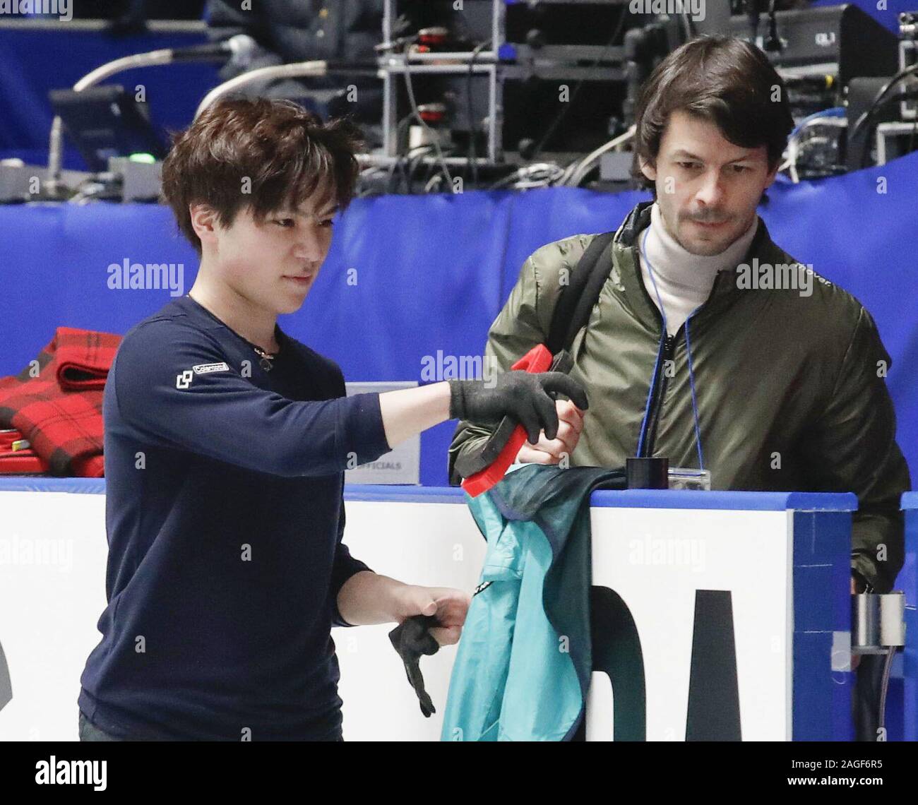 Japanese figure skater Shoma Uno (L) and Turin Olympic silver medalist  Stephane Lambiel of Switzerland are pictured after Uno took part in  official practice for the national championships in Tokyo on Dec.