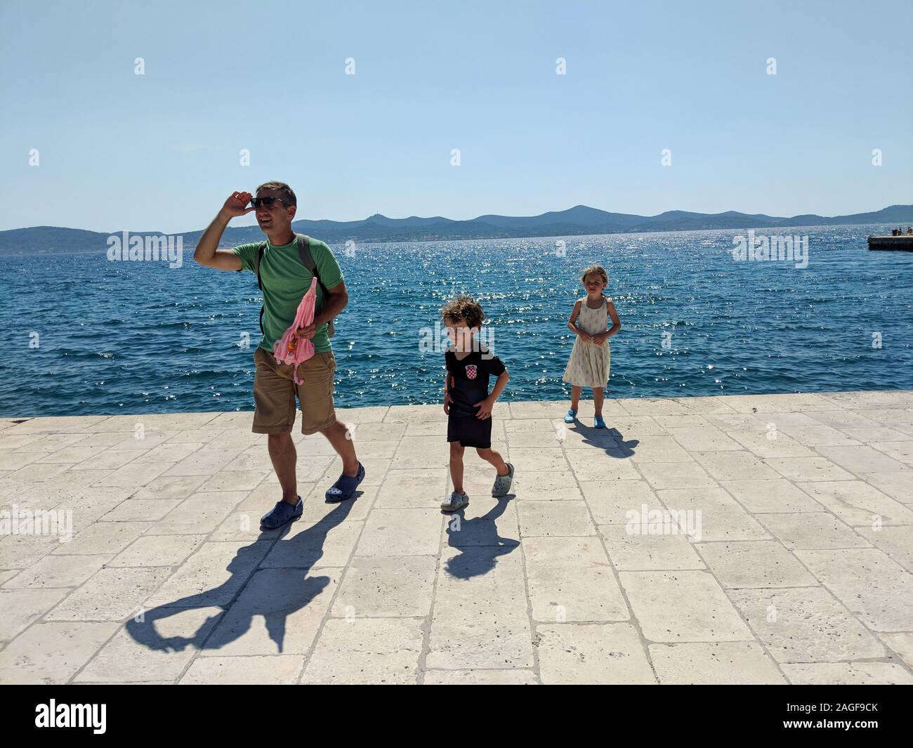 Young family by the sea in Zadar Stock Photo