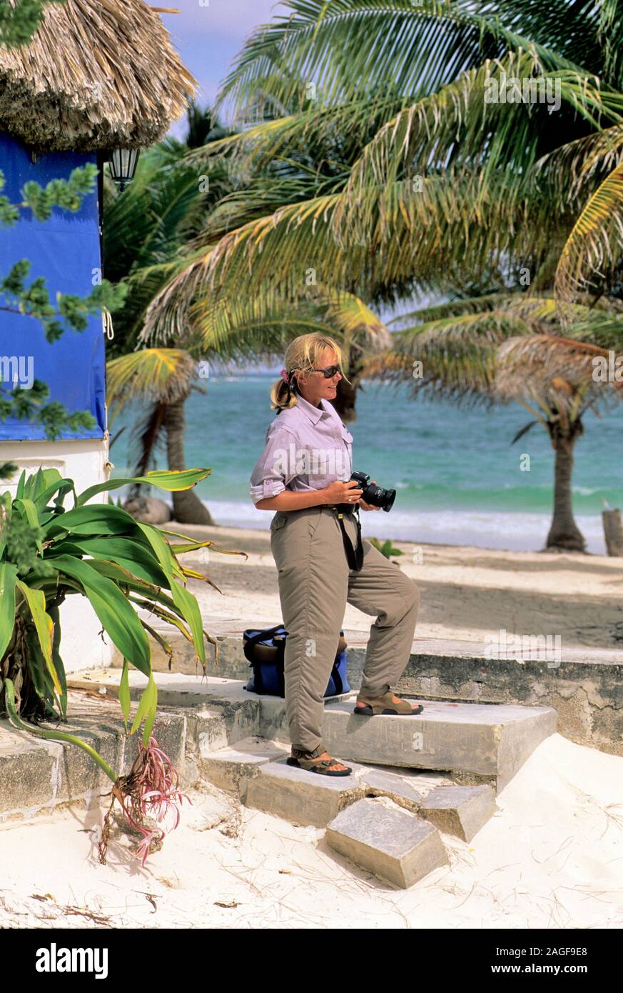 Women takes photos on a beach in Mexico Stock Photo