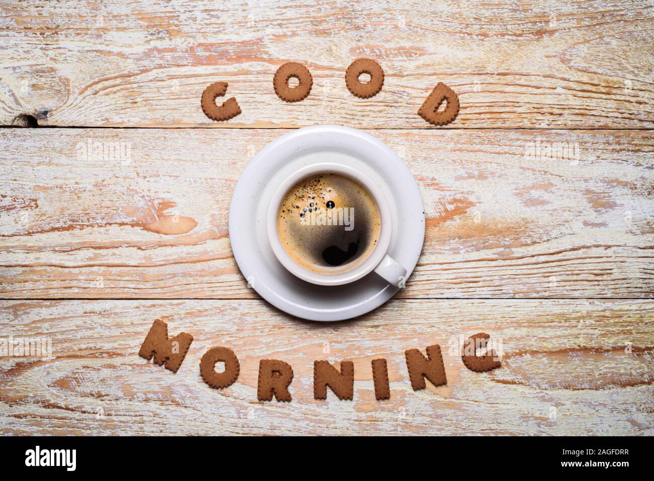 Cup of morning coffee with cookies. Words Good Morning on table ...