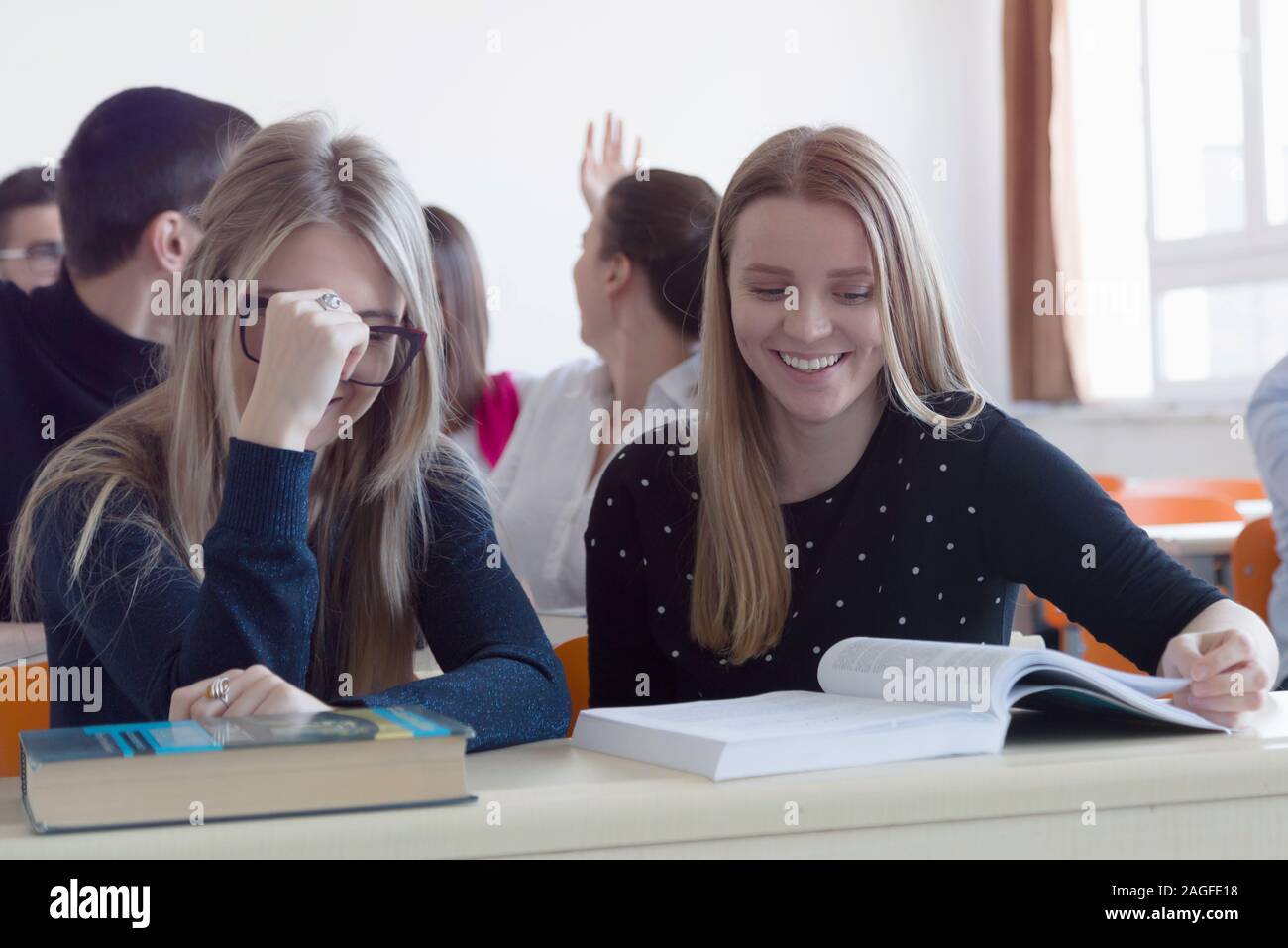 University students listening while Male professor explain lesson to ...