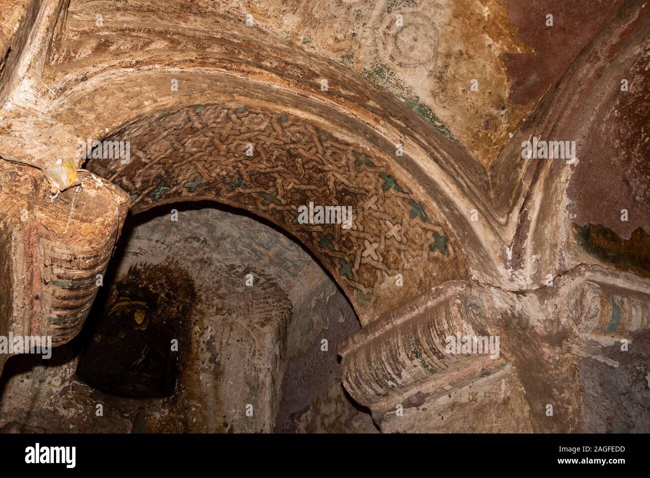 Ethiopia, Amhara Region, Lalibela, Arbatu Ensessa, Biblia Chirkos, ancient rock hewn church, ancient wall painting patterned design above arch Stock Photo