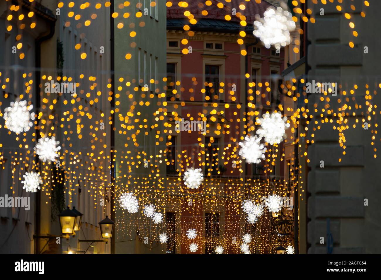 Gesandtenstraße in Regensburg with christmas light chain decoration during night Stock Photo
