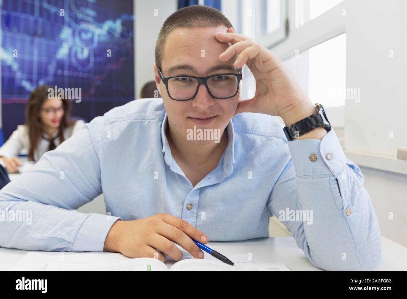 Youngmale student in math class overwhelmed by the math formula ...