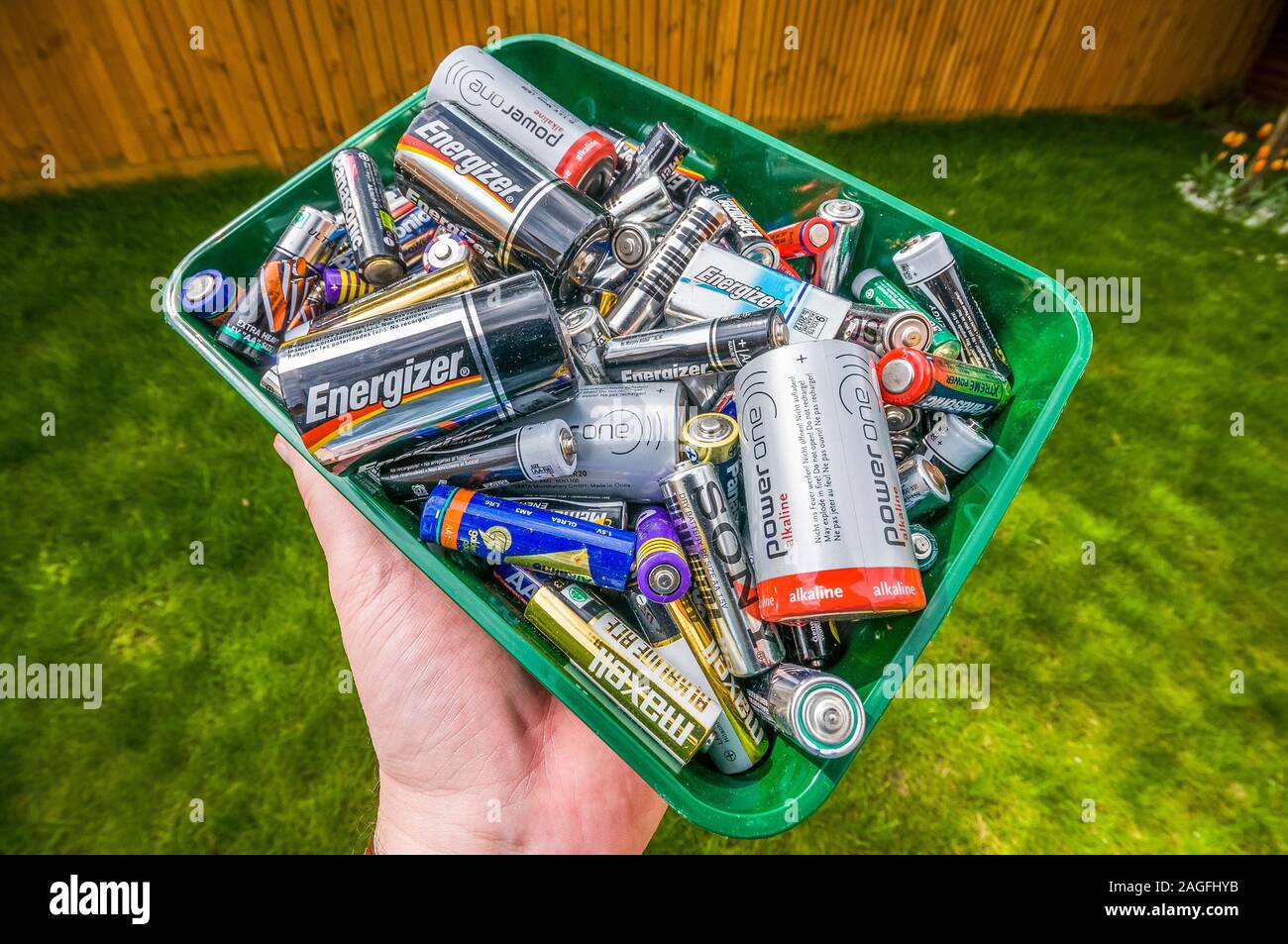 box of old batteries being saved for recycling at local recycling site
