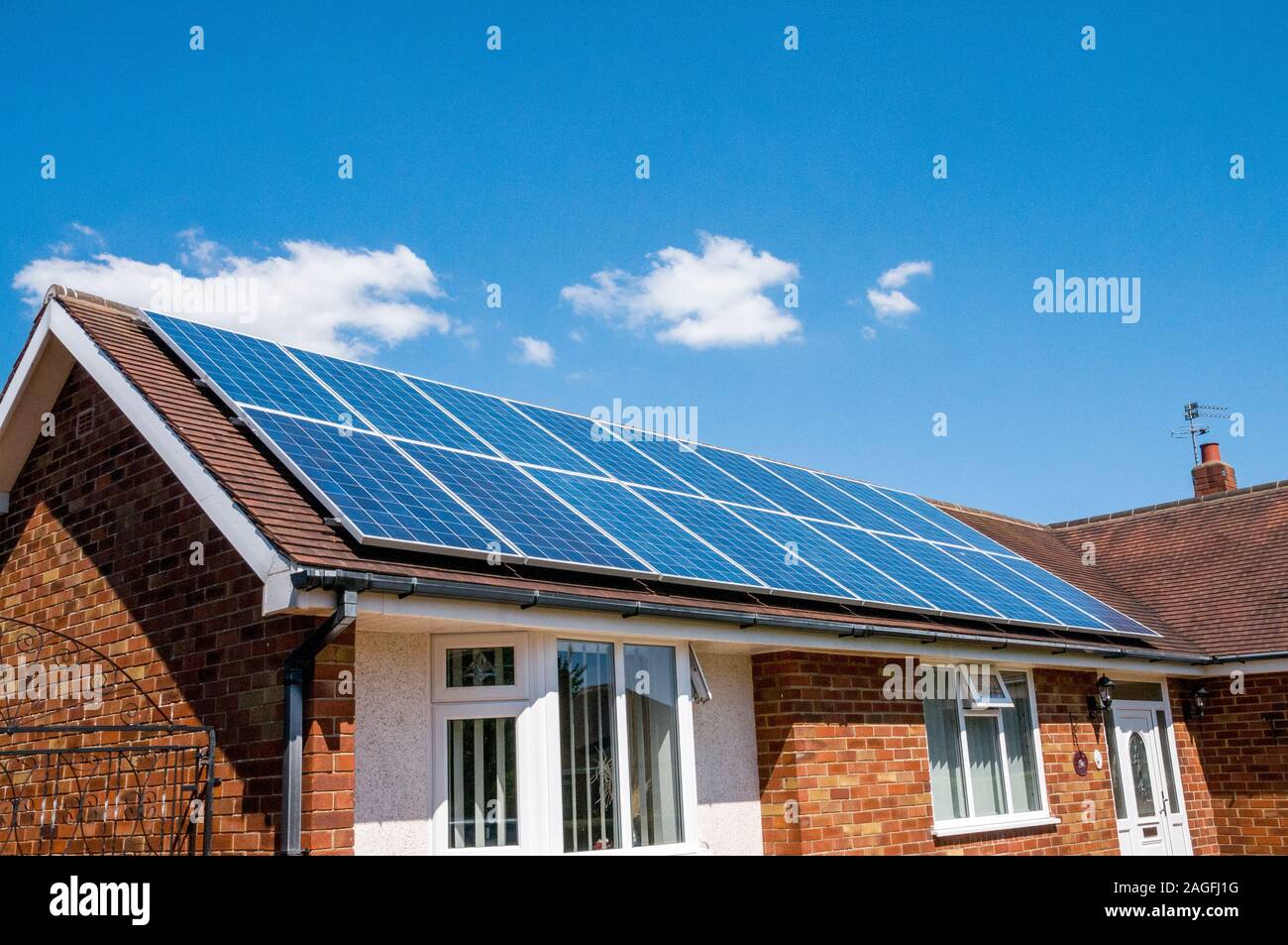 house,bungalow with roof converted to solar panels,england,uk Stock Photo