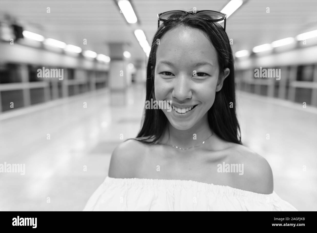 Young japanese woman smiling hi-res stock photography and images - Alamy