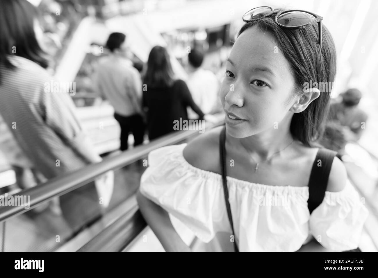 Young beautiful tourist woman exploring the city of Bangkok Stock Photo