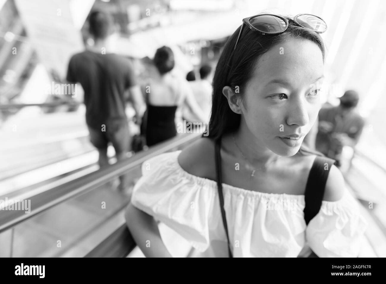 Young beautiful tourist woman exploring the city of Bangkok Stock Photo